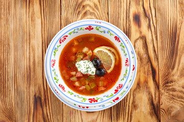Soup with meat, vegetables, olives
