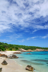 Picturesque tropical golden sandy Sunset Beach with turquoise water on Lizard Island, Australia. Lizard Island  is located on Great Barrier Reef in north-east part of Queensland