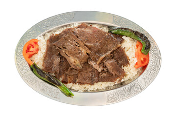 Top view traditional turkish meat and food service, Doner kebab over rice on a metal plate, top view, white background.