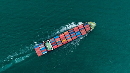 logistic cargo container ship sailing in sea to import export goods and distributing products to...