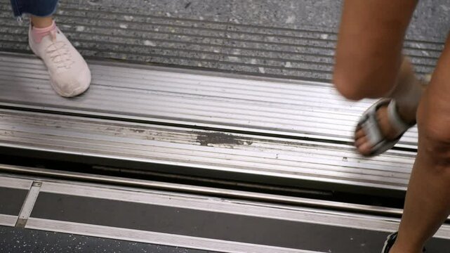 pov to gate door of skytrain public transportation while door is open and passengers get off the train commuter,train public transportation in rush hour