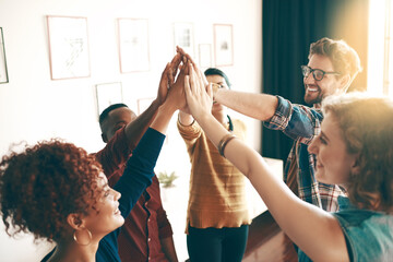Designers, high five and happy in studio for support, teamwork and inclusion in design agency....