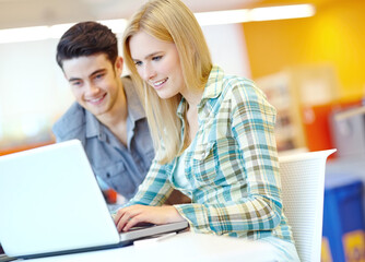 Students, university and laptop for research, learning and higher education with project, studying and smile. Friends, man and woman with computer, library or college with proposal, planning or email