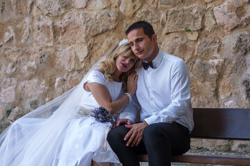 Bride and groom resting together on wedding day