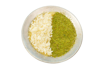 Raw katmer with clotted cream and pistachios served on a metal plate with lots of pistachios on...