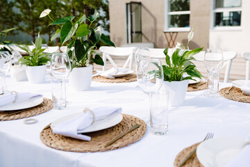 Beautifully set table in white colors