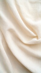 Fototapeta premium Soft, creamy white fabric draped elegantly, showcasing its smooth texture and delicate folds.