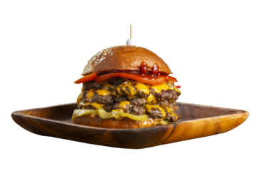 Big tasty burger with fried cutlet, cabbage salad, tomatoes and sauce on wooden plate isolated on white background.