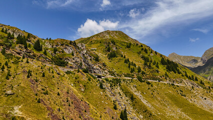 Top cinematic aerial view to the Transfagaras famous curvy road in Romania. Aerial view of Transfagarasan road in Fagarash Mountain.