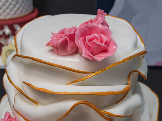 Elegant White Wedding Cake with Pink Roses