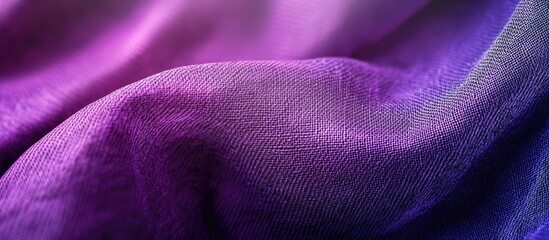 Close up of an abstract flat purple fabric pattern with high detail featuring textured backgrounds in partial focus and realistic light reflections. with copy space image