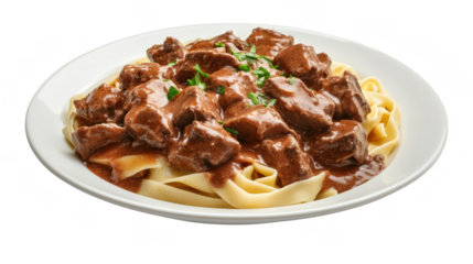 Delicious beef stroganoff served over fettuccine pasta, garnished with fresh parsley, creating rich and savory dish that is perfect for any meal. 