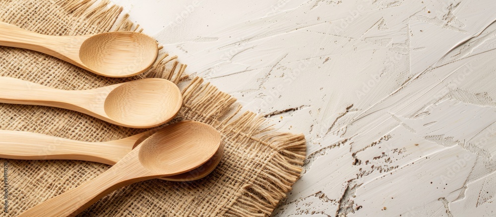 Aufkleber top view of eco friendly disposable wooden spoons in a lovely natural hue placed on harmonious craft