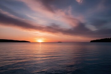 Fototapeta premium Stunning Sunset Reflected on Calm Water with Peaceful Light and Captivating Atmosphere
