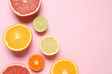 Tropical fruits on a colored background. Summer concept. Flat lay, top view, copy space