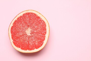 Fresh grapefruit on a color background