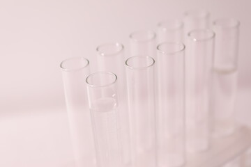 Laboratory test tubes on colored background