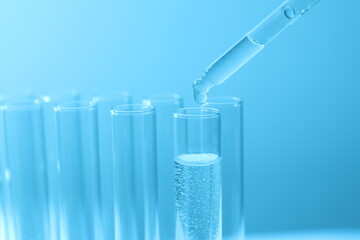 Laboratory test tubes on colored background