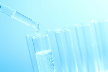 Laboratory test tubes on colored background