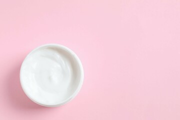 Moisturizing care skincare face cream for healing complicated troubled skin type in an open jar with visible texture