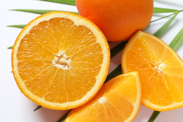 Fresh orange citrus with green leaves isolated on white background