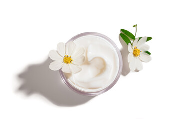 Cosmetic cream jar with white flower
