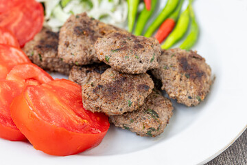 The famous Milas meatballs are made with tomatoes, onions, red and green peppers.