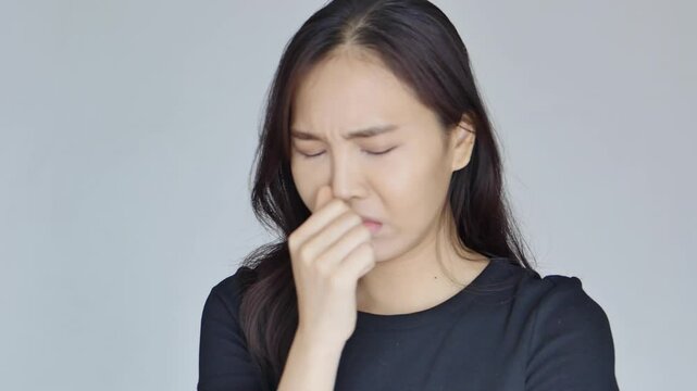 Sick woman having cold, flu, allergy and runny nose