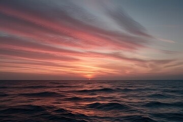 Fototapeta premium Sunset Horizon Glow Over Calm Ocean Waves