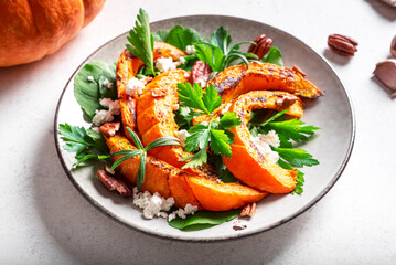 Autumn salad with grilled pumpkin, cottage cheese and pecan nuts