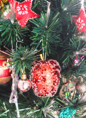 Artificial Christmas tree with traditional decor.