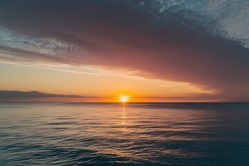 Obraz premium Vibrant Sunrise Above Serene Ocean Waves with Colorful Highlights