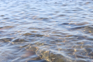A close-up shot of a body of water with rocks surrounding it, great for use as a background or decorative element