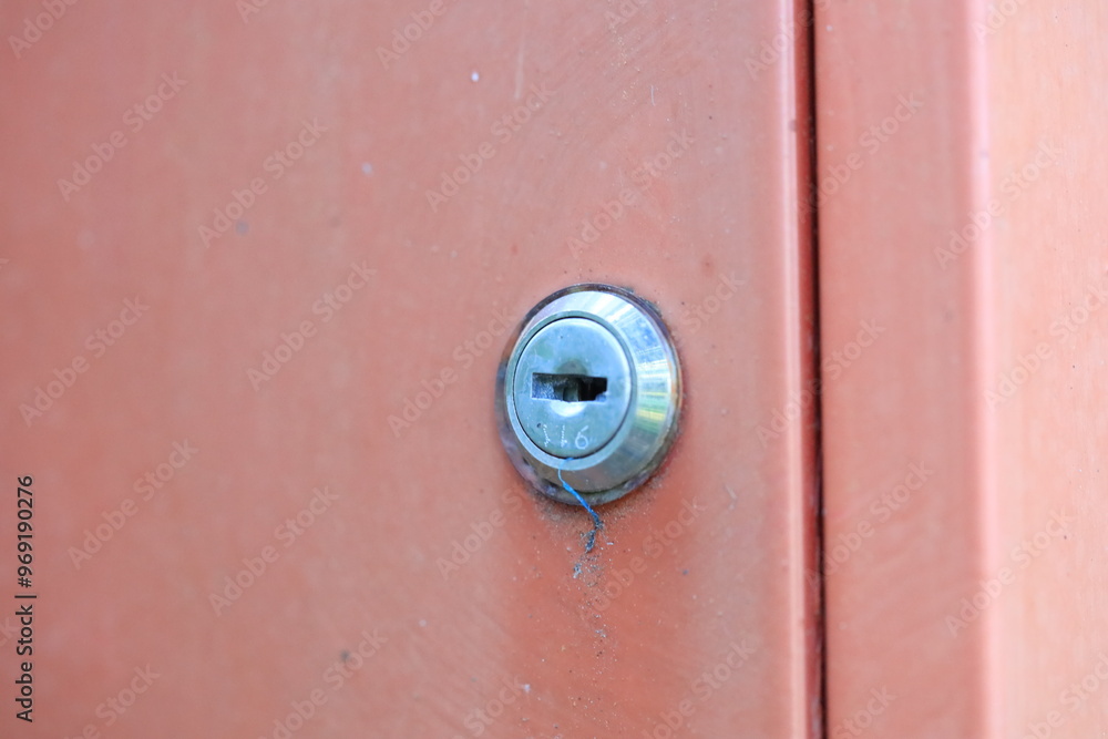 Poster A close-up shot of a door with a keyhole, perfect for use in illustrations or designs where a sense of security or secrecy is needed