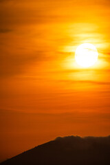 Giant orange sun set red sky and cloud move silhouette.Open view background.-Image