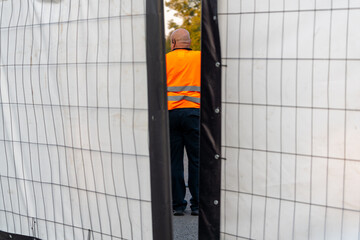 Security guard on the backstage of a concert, ensuring safety and smooth operations during the event