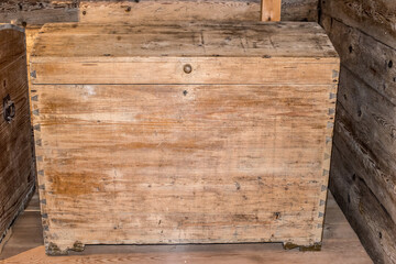 Old wooden chest against wooden wall