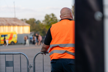 Security guard on the backstage of a concert, ensuring safety and smooth operations during the event
