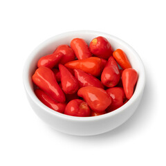 Bowl with pickled  tiny red mexican tiny peppers isolated on white background close up