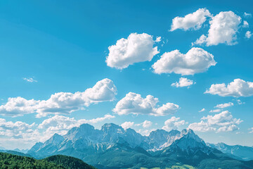 Fototapeta premium A serene mountain paradise with clear blue sky and fluffy clouds