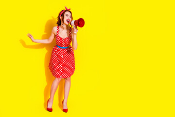 Photo of lovely pretty cute lady wear red trendy clothes look empty space isolated on yellow color background