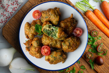 Spinach fritters, traditional Spanish tapa. Top view table.
