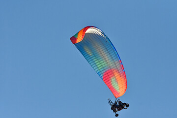 A hang glider pilot in the air