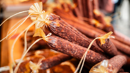 A close-up view of appetising sausages in a basket at the local farmer market