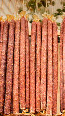 Delicious sausages hanging at the counter at the local market