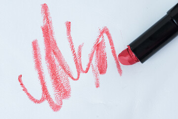 Dirty cosmetic lipstick stain in the white leather chair or upholstery. everyday life stain...