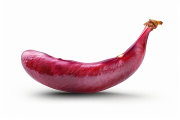 A single red banana sitting on a white surface