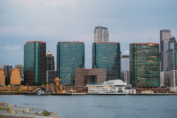 A stunning modern city skyline featuring an impressive waterfront view that captivates