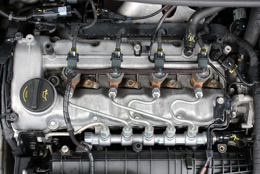 Close up Diesel engine. Fuel system of car. Diesel engine injectors. Detail of modern common rail diesel engine repair, rail, pipeline and injectors. Common rail injection system the parts of diesel.
