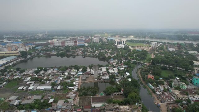Aerial footage of Karail slum area and Banani residential district at sunset in Dhaka, Bangladesh